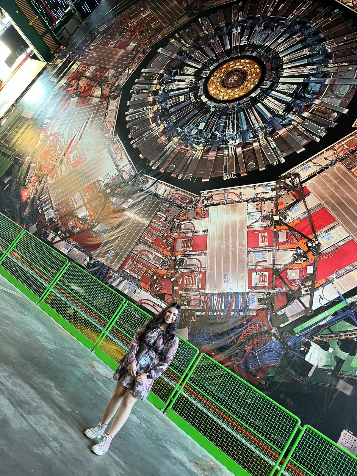 Palma in front of a real-size photo of the CMS detector