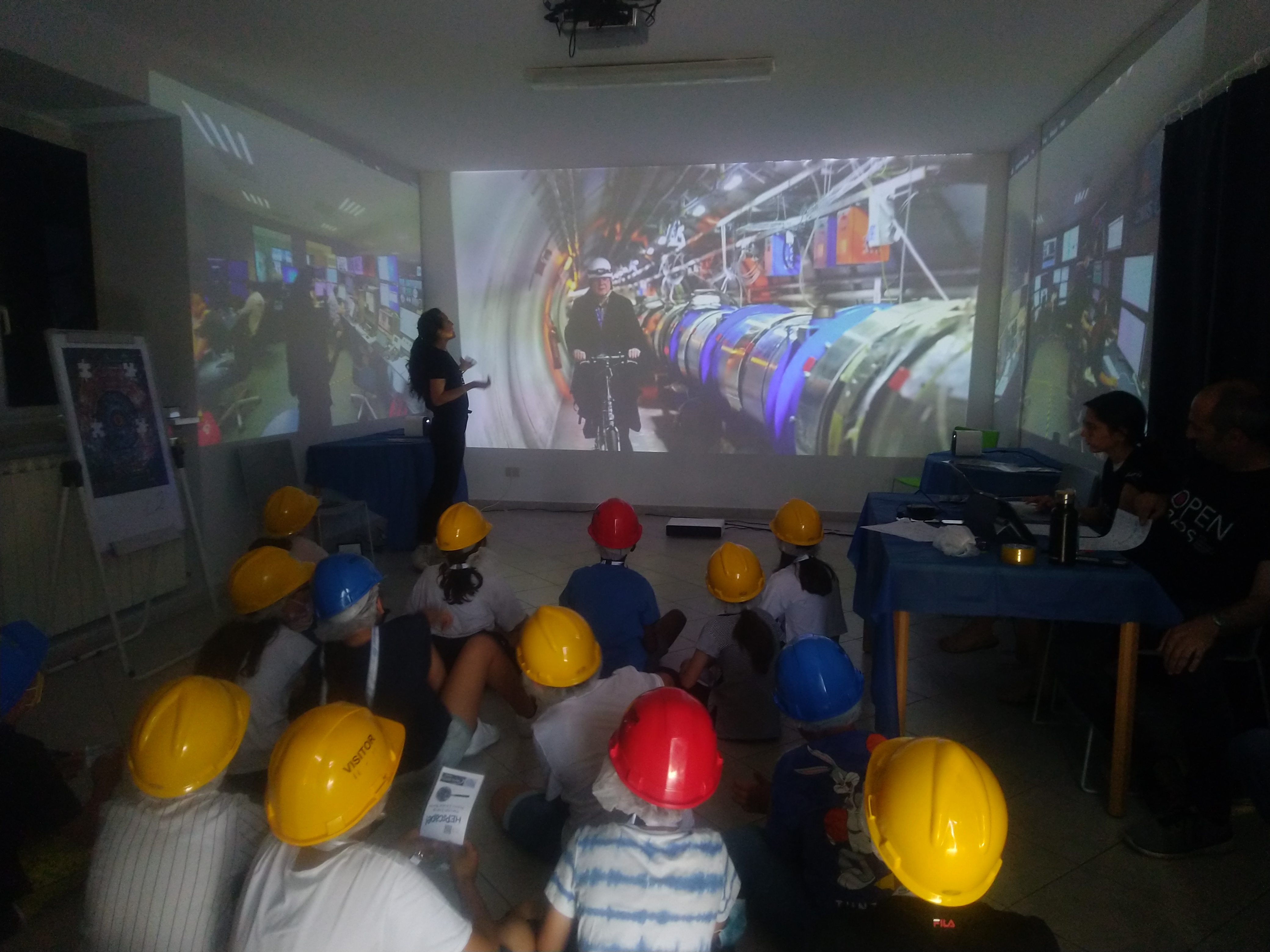 Visitors are watching on a big screen the accelerator 